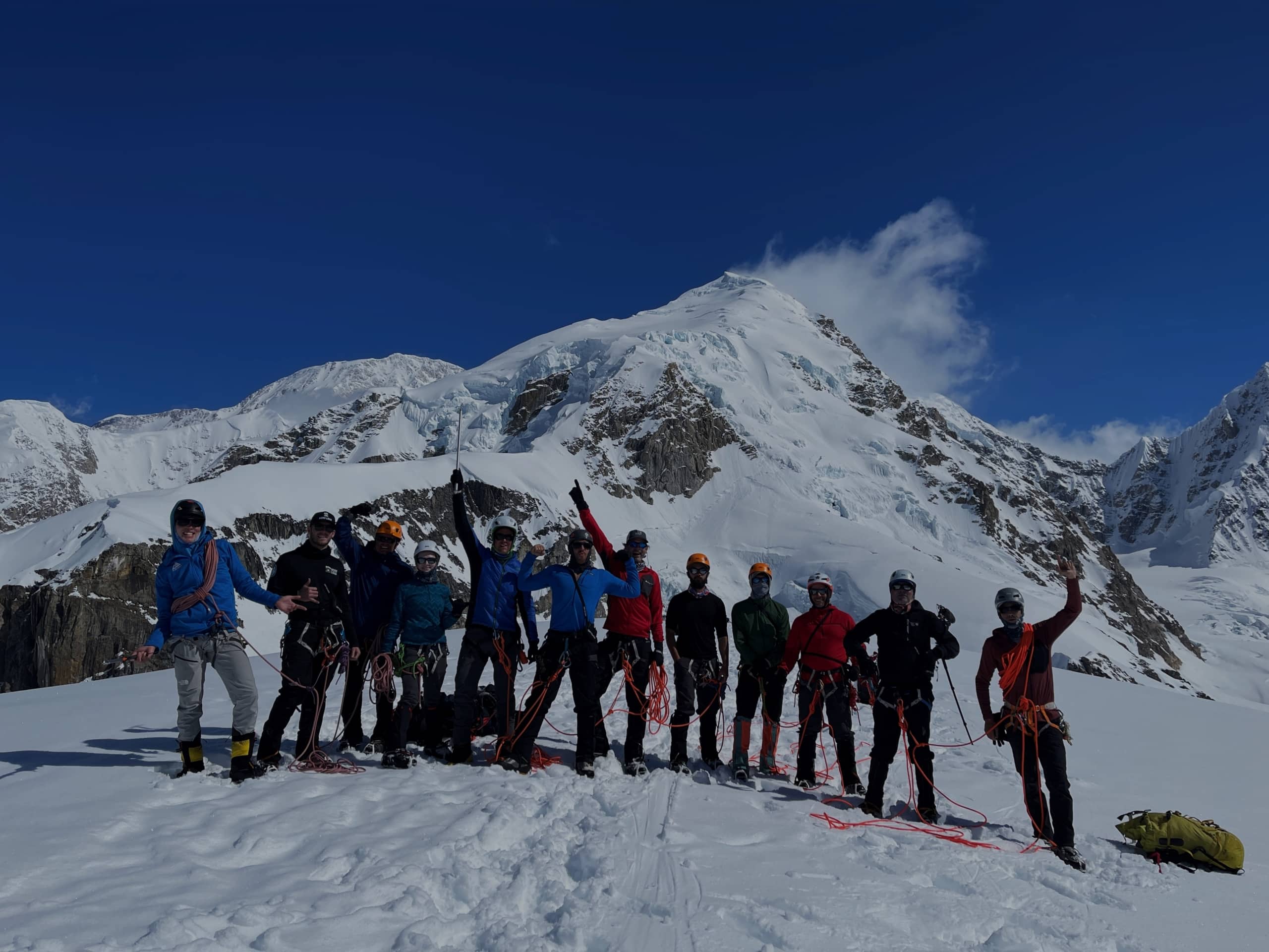 Climbers in a dramatic alpine landscape.